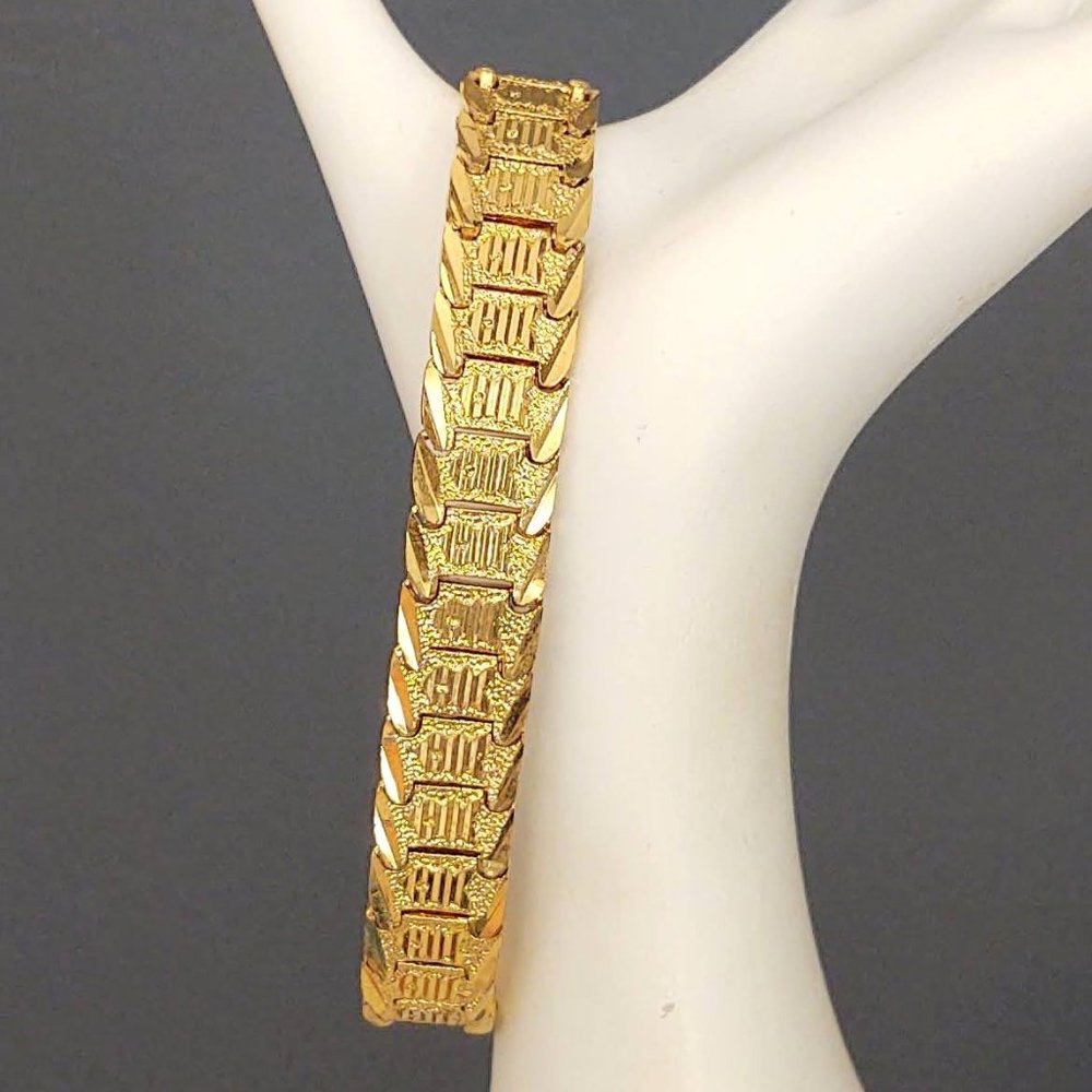 Bright, shiny gold panel link bracelet